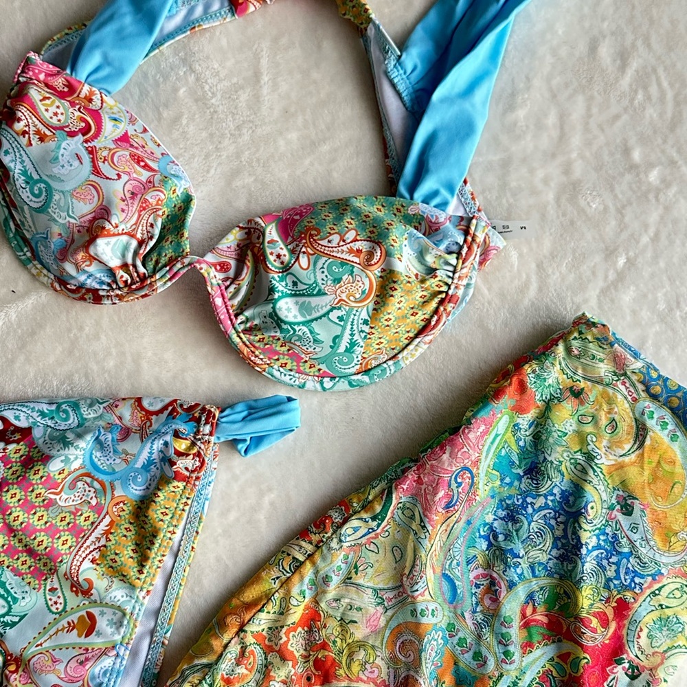 Bikini set. Never worn. Comes with little skirt.